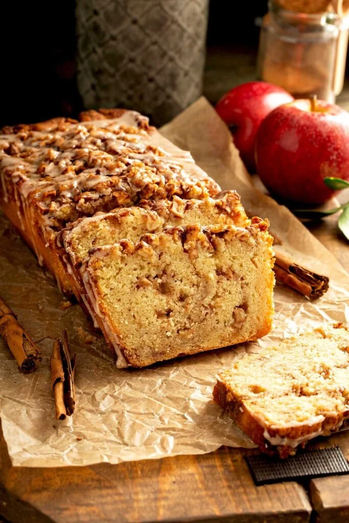 Freshly baked Cinnamon Apple Bread with spices and apple slices.