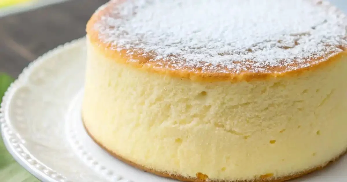 Fluffy Cotton Cheesecake served on a plate, showcasing its airy texture and creamy top.