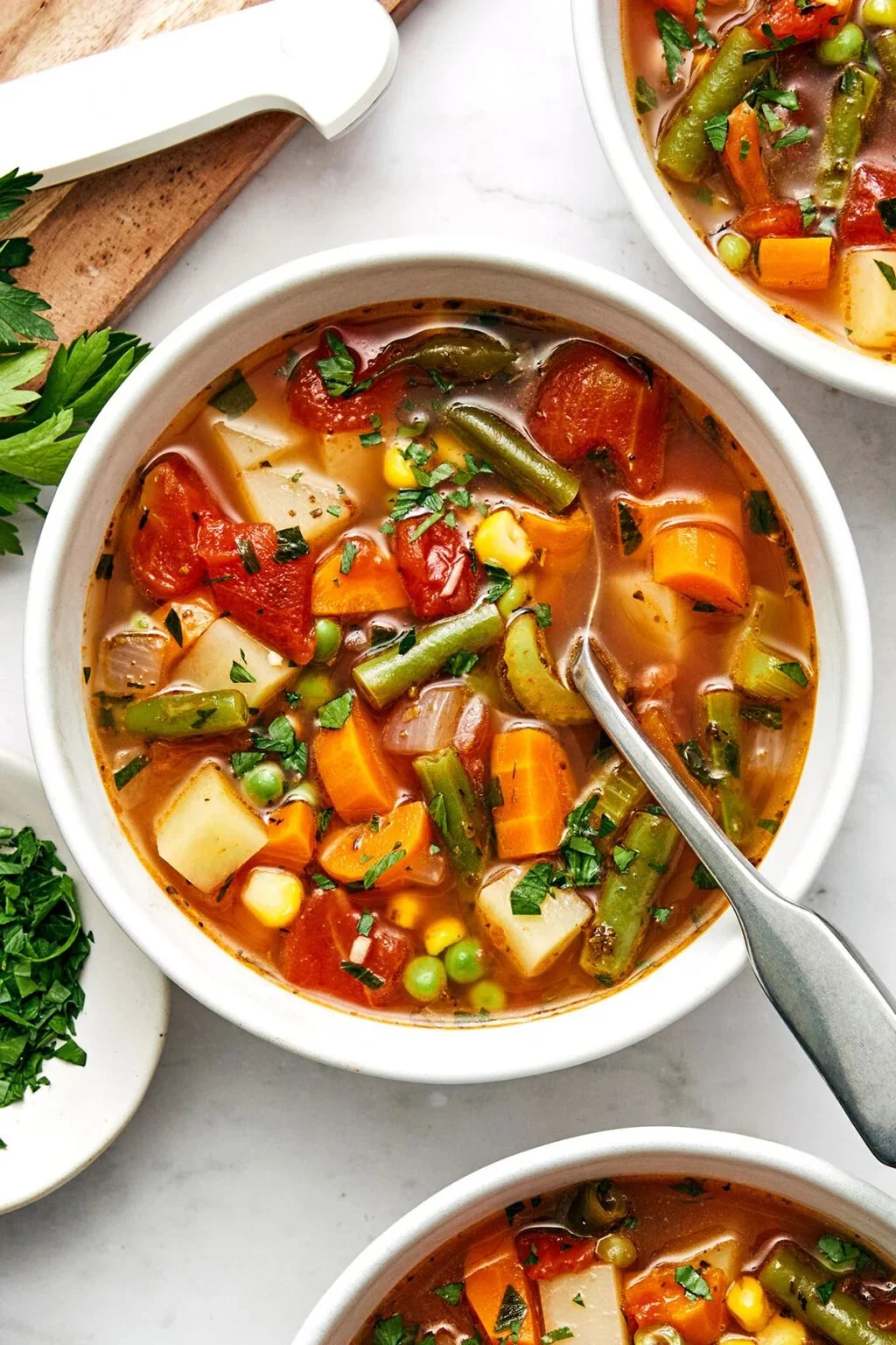 Bowl of easy vegetable soup with fresh ingredients and herbs