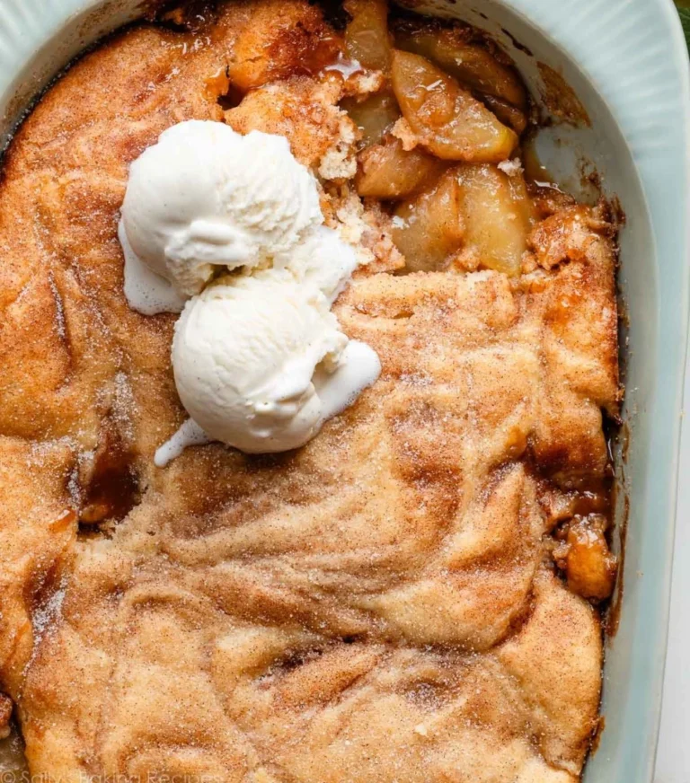 Freshly baked apple cobbler served in a rustic dish with a scoop of ice cream