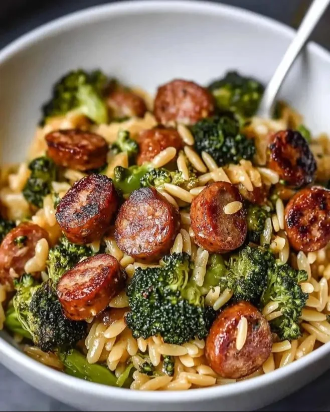 Chicken Sausage and Broccoli Orzo dish garnished with herbs