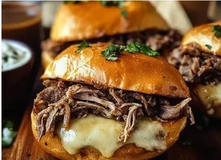 Delicious Crock Pot French Dip Sandwiches served with au jus dipping sauce