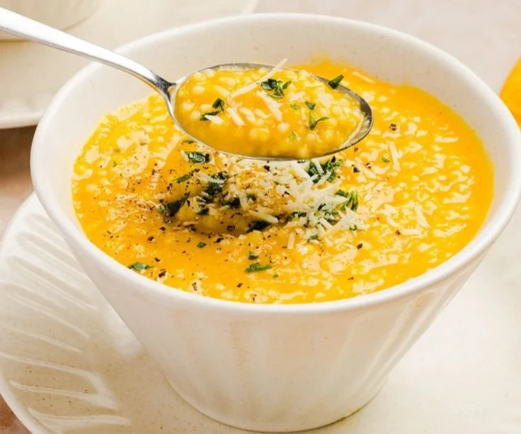 Bowl of Italian Penicillin Soup with fresh herbs and vegetables