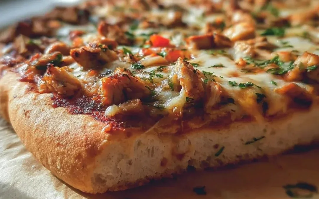 Delicious pizza crust made with canned chicken, ready to be topped.