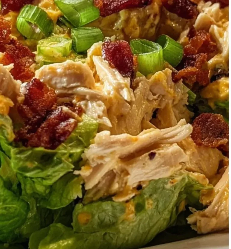 Delicious carnivore loaded chicken salad topped with fresh ingredients.