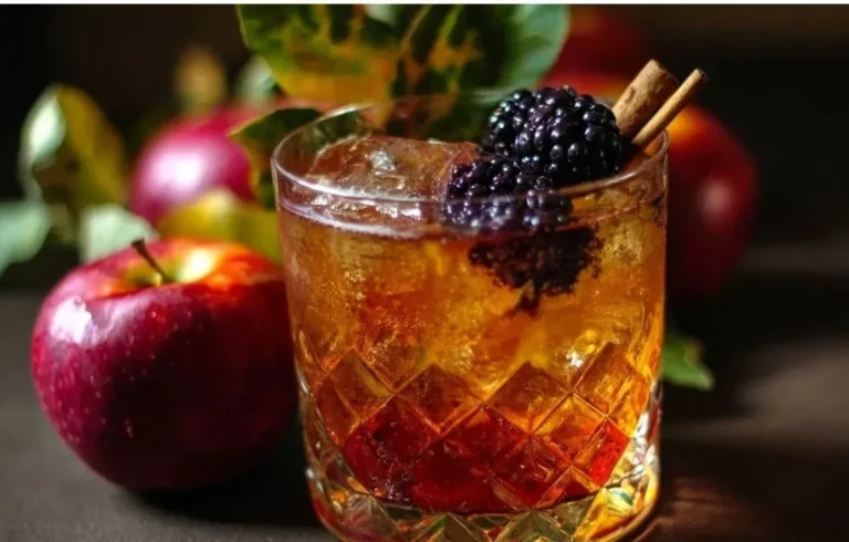 Poisoned Apple Cider Cocktail with apple slices and garnish