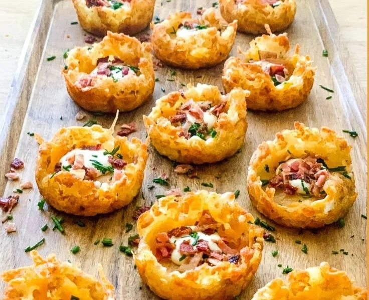Delicious loaded tater tots appetizers topped with cheese and toppings