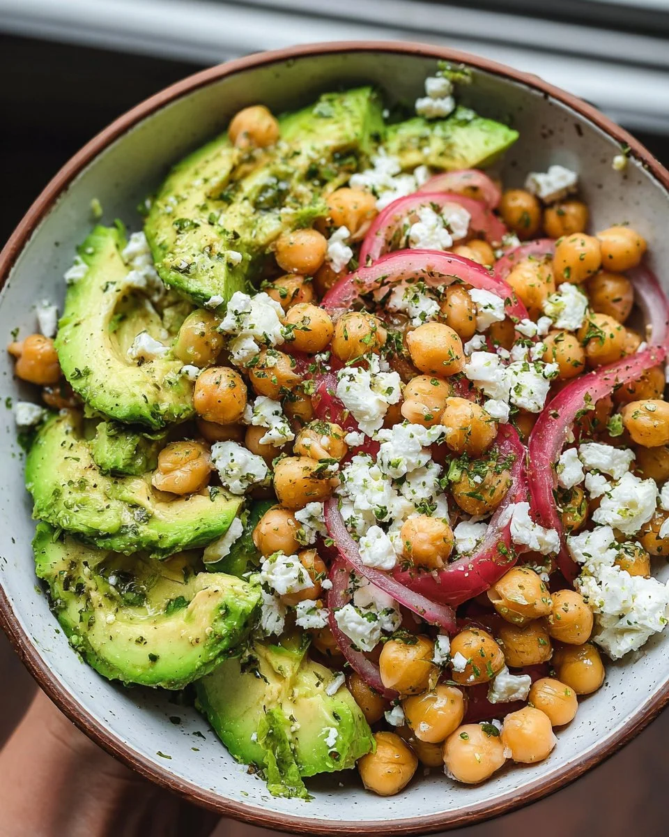 Delicious Chickpea Feta Avocado Salad in a bowl with colorful vegetables