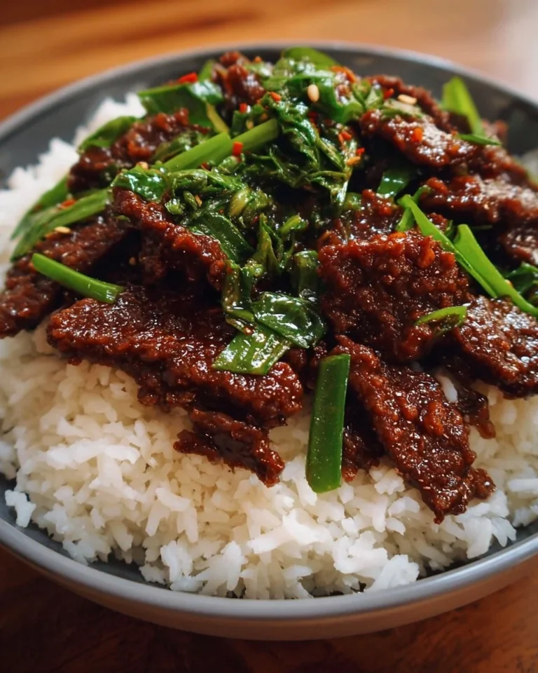 Delicious bowl of comforting Mongolian Beef with tender beef and flavorful sauce.