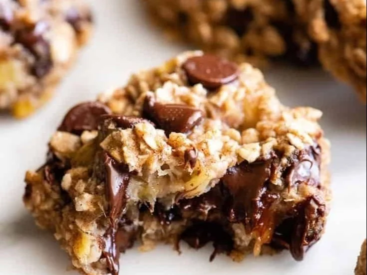 Freshly baked banana oatmeal cookies on a wooden table