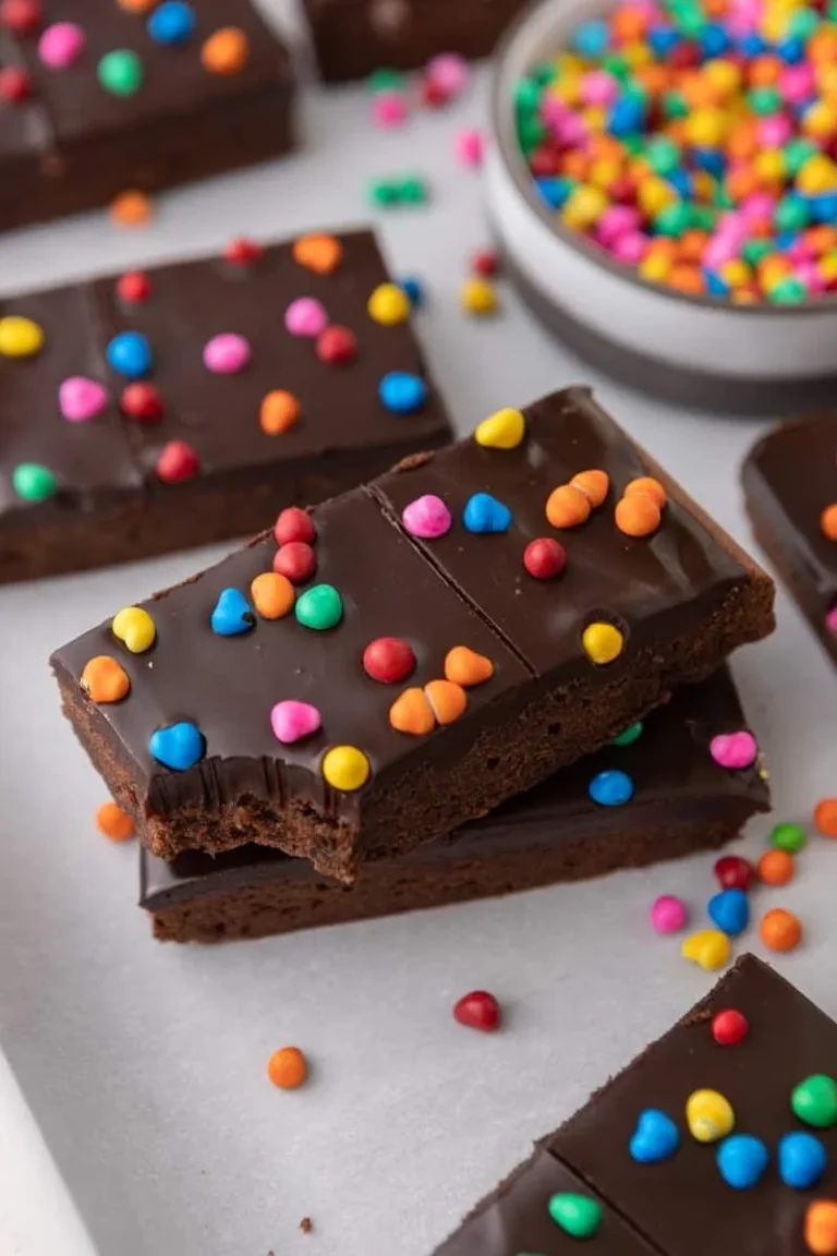 Decadent gourmet Cosmic Brownies with colorful sprinkles and rich chocolate frosting