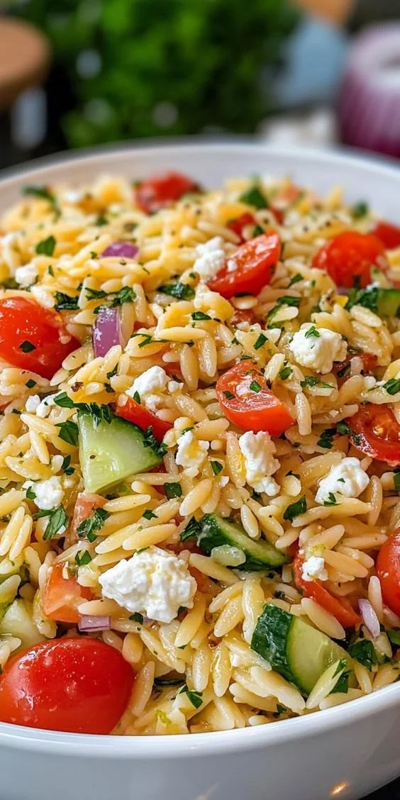 Delicious Lemon Orzo Pasta Salad served in a bowl with fresh ingredients