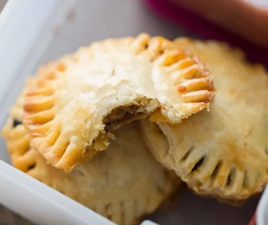 Golden mini taco hand pies filled with seasoned beef and cheese