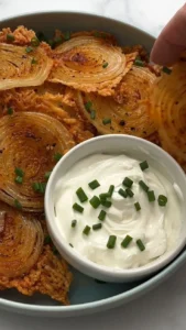 A bowl of crispy onion ring chips, golden and crunchy snack perfect for any occasion