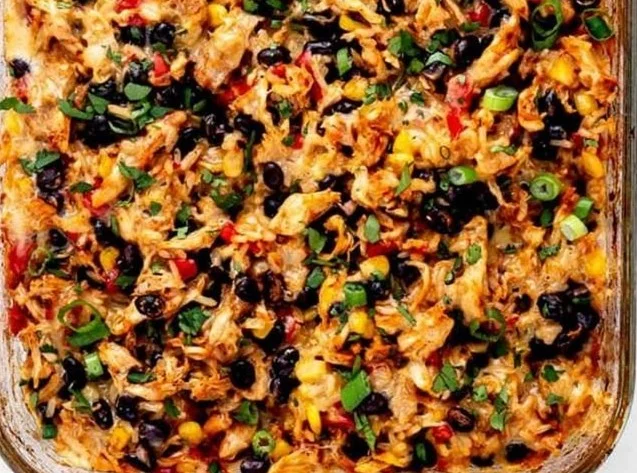 Delicious Protein Burrito Casserole topped with cheese and vegetables