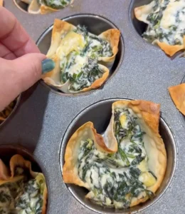 Crispy spinach artichoke wonton cups filled with creamy mixture